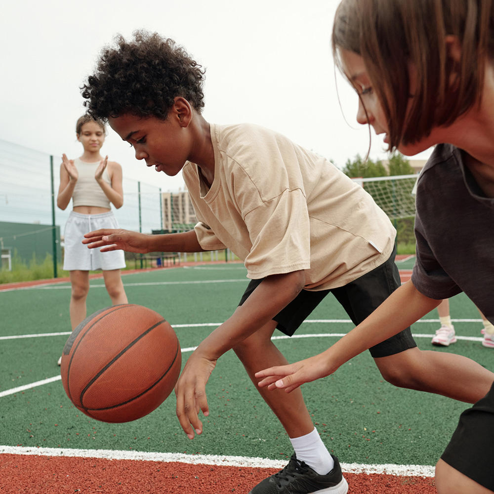 Kids practicing basketball